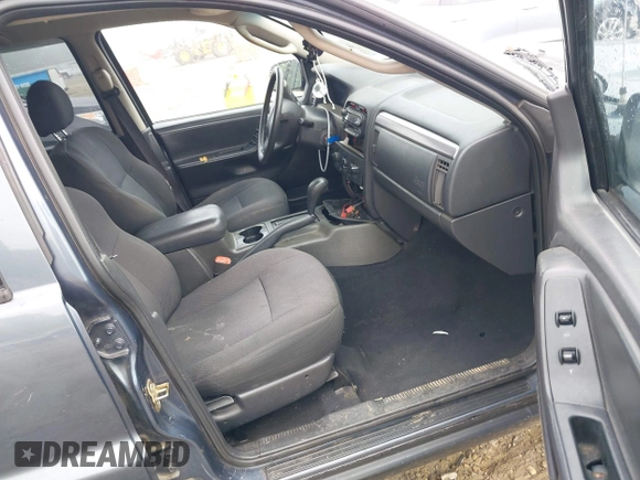 2002 Jeep Grand Cherokee Laredo z VIN 1J4GX48S62C201579, wystawiony jako IAAI lot #42102238 z przebiegiem 262 630 mil mil oraz . Historia ofert i sprzedaży dostępna na DreamBid. Obrazek 5.