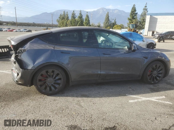 2022 Tesla Model Y Performance with VIN 7SAYGDEF3NF490643, listed as a Copart auction lot 46975825 with 50,792 mi miles and Salvage Title. Bid and sale history available at DreamBid. Image 3.