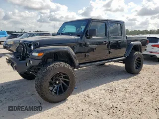 2021 Jeep Gladiator Freedom with VIN 1C6HJTAG8ML580882, listed as a Copart auction lot 57690885 with Not provided miles and Salvage title. Bid and sale history available at DreamBid. Image 1.