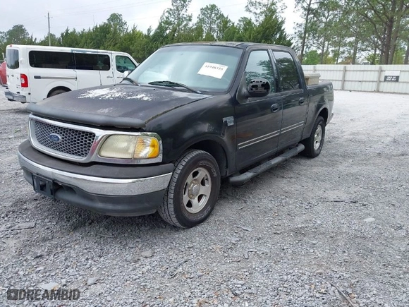 2002 Ford F-150 XLT with VIN 1FTRW07612KD59994, listed as a IAAI auction lot 41948335 with 1 mi miles. Bid and sale history available at carsss.com. Image 2.