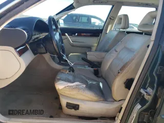 1995 Audi A6 z VIN WAUHA84A1SN052824, wystawiony jako Copart lot #78849124 z przebiegiem 152 894 mil mil oraz Szkody całkowita. Historia ofert i sprzedaży dostępna na DreamBid. Obrazek 7.