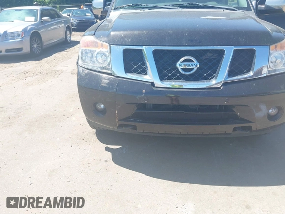 2014 Nissan Armada Platinum z VIN 5N1BA0NE9EN611807, wystawiony jako IAAI lot #42297717 z przebiegiem 199 541 mil mil oraz . Historia ofert i sprzedaży dostępna na DreamBid. Obrazek 6.