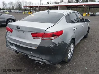 2016 Kia Optima LX with VIN 5XXGT4L31GG047355, listed as a IAAI auction lot 41657204 with 116,989 mi miles. Bid and sale history available at carsss.com. Image 4.