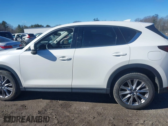 2019 Mazda CX-5 Grand Touring with VIN JM3KFBDM2K0672720, listed as a IAAI auction lot 41751196 with 51,632 mi miles and . Bid and sale history available at carsss.com. Image 14.