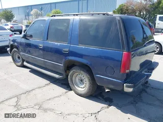 1999 Chevrolet Tahoe with VIN 1GNEC13R7XJ573387, listed as a IAAI auction lot 42001191 with 241,007 mi miles. Bid and sale history available at carsss.com. Image 3.