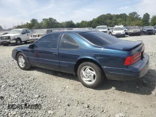 1996 Ford Thunderbird LX z VIN 1FALP62WXTH177910, wystawiony jako Copart lot #70954694 z przebiegiem 86 316 mil mil oraz Szkoda całkowita • Salvage title. Historia ofert i sprzedaży dostępna na DreamBid. Obrazek 2.