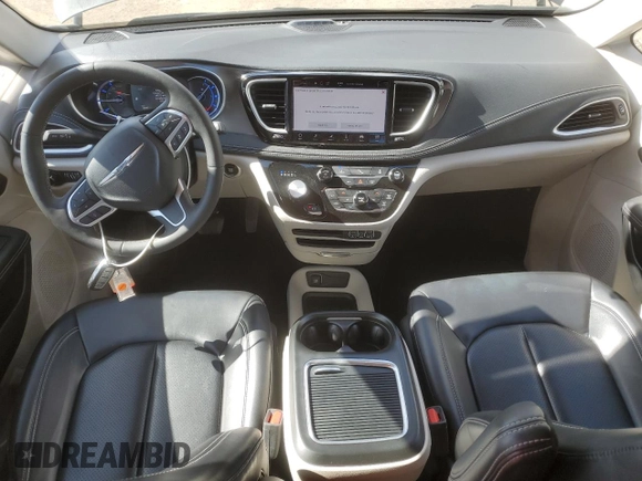 2023 Chrysler Pacifica Hybrid Touring L with VIN 2C4RC1L79PR608659, listed as a Copart auction lot 56945365 with 45,697 mi miles and Salvage title. Bid and sale history available at DreamBid. Image 8.