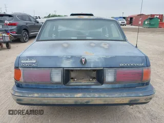 1990 Pontiac Bonneville z VIN 1G2HX54C6L1204370, wystawiony jako IAAI lot #42283309 z przebiegiem 114 427 mil mil oraz . Historia ofert i sprzedaży dostępna na DreamBid. Obrazek 16.
