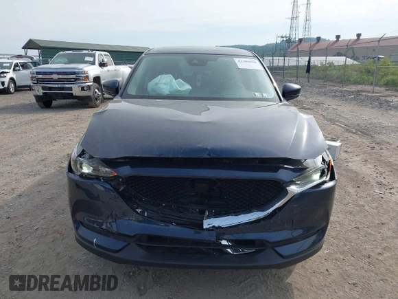 2021 Mazda CX-5 Touring z VIN JM3KFBCMXM0389857, wystawiony jako IAAI lot #42309650 z przebiegiem 49 938 mil mil oraz . Historia ofert i sprzedaży dostępna na DreamBid. Obrazek 12.