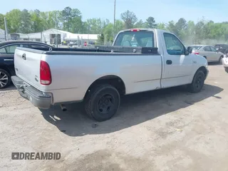 2002 Ford F-150 XL with VIN 1FTRF17202NB42616, listed as a IAAI auction lot 42117616 with 230,852 mi miles. Bid and sale history available at carsss.com. Image 4.
