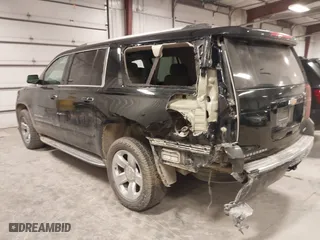 2017 Chevrolet Suburban Premier with VIN 1GNSKJKC0HR250854, listed as a IAAI auction lot 41541476 with 128,231 mi miles. Bid and sale history available at carsss.com. Image 3.