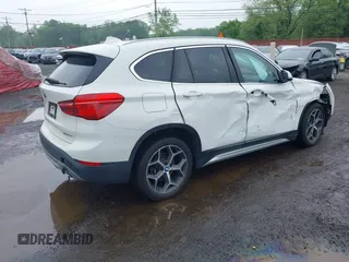 2018 BMW X1 xDrive28i with VIN WBXHT3C38J5L31322, listed as a IAAI auction lot 42260190 with 70,266 mi miles and . Bid and sale history available at DreamBid. Image 4.