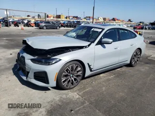 2022 BMW 4 Series 430i with VIN WBA63AV01NFM70409, listed as a Copart auction lot 55944335 with 21,718 mi miles and Salvage title. Bid and sale history available at DreamBid. Image 1.
