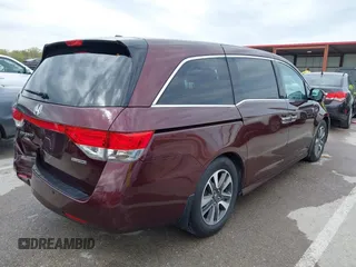 2014 Honda Odyssey Touring with VIN 5FNRL5H9XEB073156, listed as a IAAI auction lot 41990714 with 166,129 mi miles and . Bid and sale history available at DreamBid. Image 4.