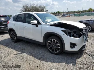 2016 Mazda CX-5 Grand Touring with VIN JM3KE2DY0G0804354, listed as a Copart auction lot 50311185 with 105,588 mi miles and Salvage Title. Bid and sale history available at carsss.com. Image 4.