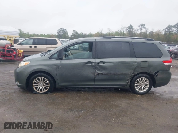 2013 Toyota Sienna XLE AAS with VIN 5TDYK3DC8DS401561, listed as a IAAI auction lot 41990044 with 214,111 mi miles and . Bid and sale history available at DreamBid. Image 14.