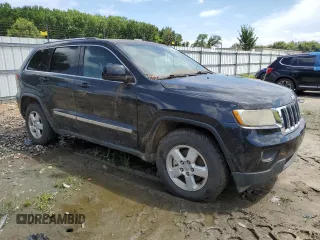 2011 Jeep Grand Cherokee Laredo with VIN 1J4RR4GG7BC512633, listed as a Copart auction lot 64906055 with 233,036 mi miles and Clean title. Bid and sale history available at DreamBid. Image 4.