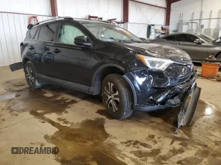 2018 Toyota RAV4 LE with VIN 2T3BFREV7JW717699, listed as a Copart auction lot 60656045 with Not provided miles and Salvage title. Bid and sale history available at DreamBid. Image 4.