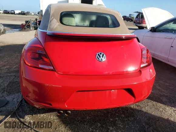 2014 Volkswagen Beetle 1.8T w/Premium z VIN 3VW517AT9EM819966, wystawiony jako Copart lot #76990014 z przebiegiem Nie podano mil oraz Nie do naprawy • Non repairable. Historia ofert i sprzedaży dostępna na DreamBid. Obrazek 6.
