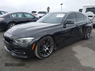 2018 BMW 3 Series 330i xDrive with VIN WBA8D9G57JNU67415, listed as a IAAI auction lot 41513343 with 98,714 mi miles. Bid and sale history available at carsss.com. Image 2.