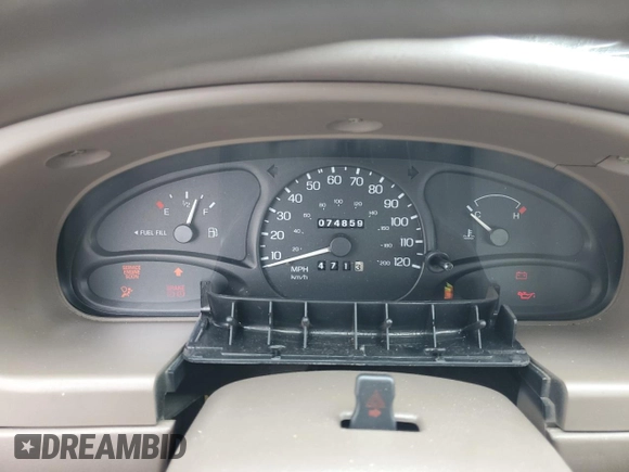 1999 Ford Escort LX with VIN 1FAFP10P6XW196483, listed as a Copart auction lot 59215635 with 74,859 mi miles and Salvage title. Bid and sale history available at DreamBid. Image 9.