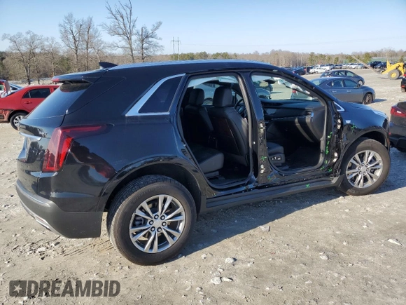 2023 Cadillac XT5 FWD Premium Luxury with VIN 1GYKNCR48PZ132957, listed as a Copart auction lot 42132845 with 27,312 mi miles and Salvage Title. Bid and sale history available at carsss.com. Image 3.