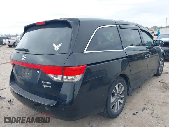 2014 Honda Odyssey Touring with VIN 5FNRL5H9XEB045695, listed as a IAAI auction lot 41545348 with 131,472 mi miles and . Bid and sale history available at carsss.com. Image 4.