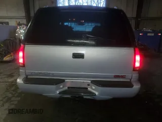2000 GMC Denali z VIN 1GKEK13R9YR104210, wystawiony jako Copart lot #85599964 z przebiegiem 1 548 394 mil mil oraz Szkody całkowita. Historia ofert i sprzedaży dostępna na DreamBid. Obrazek 6.