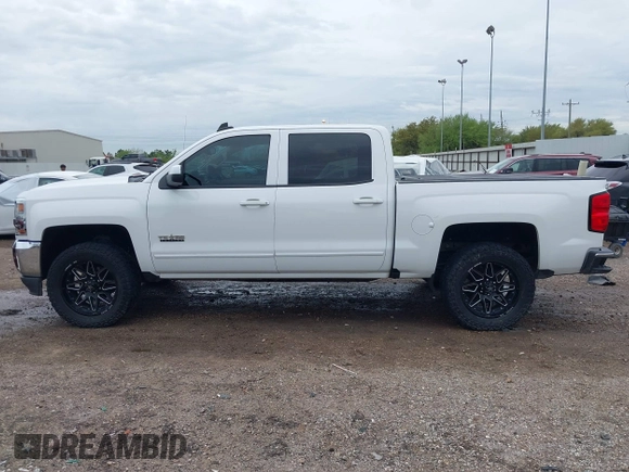 2018 Chevrolet Silverado 1500 LT with VIN 3GCPCREC7JG402401, listed as a IAAI auction lot 41880462 with 128,995 mi miles and . Bid and sale history available at DreamBid. Image 14.