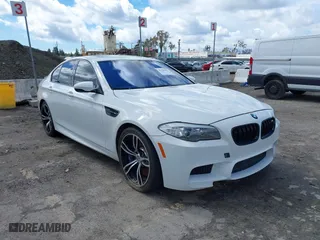 2013 BMW M5 with VIN WBSFV9C56DC772961, listed as a IAAI auction lot 41765457 with 104,568 mi miles. Bid and sale history available at carsss.com. Image 1.