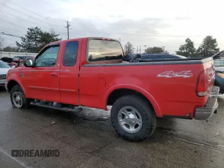 2001 Ford F-150 XL with VIN 1FTRX18L21NA50586, listed as a Copart auction lot 84245554 with 0 mi miles and Salvage Title. Bid and sale history available at carsss.com. Image 2.