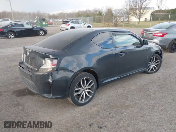 2015 Scion tC with VIN JTKJF5C7XFJ001662, listed as a IAAI auction lot 41843123 with 128,851 mi miles. Bid and sale history available at carsss.com. Image 4.