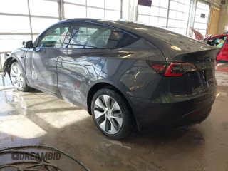 2021 Tesla Model Y Long Range with VIN 5YJYGDEE2MF087871, listed as a IAAI auction lot 41370004 with 85,757 mi miles. Bid and sale history available at carsss.com. Image 3.