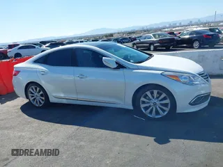 2017 Hyundai Azera Limited z VIN KMHFH4JG9HA579125, wystawiony jako IAAI lot #41718120 z przebiegiem 51 005 mil mil oraz . Historia ofert i sprzedaży dostępna na DreamBid. Obrazek 13.