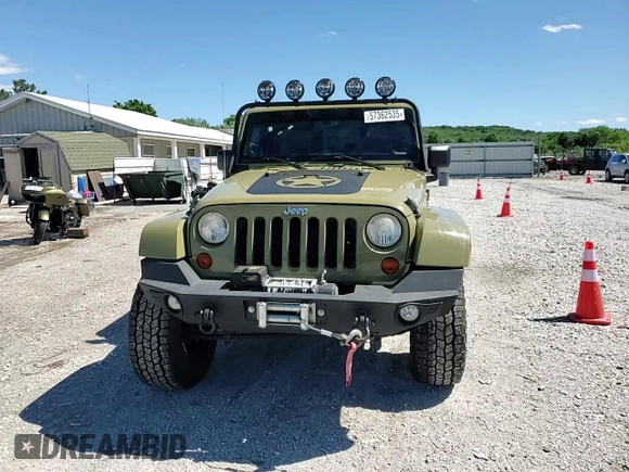 2013 Jeep Wrangler Unlimited Rubicon with VIN 1C4BJWFG0DL587057, listed as a Copart auction lot 57362535 with 102,684 mi miles and Salvage title. Bid and sale history available at DreamBid. Image 14.