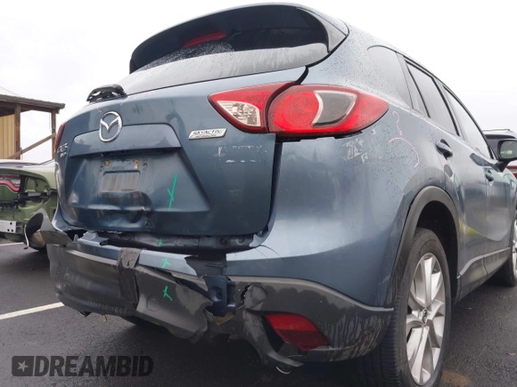 2015 Mazda CX-5 Grand Touring with VIN JM3KE4DY0F0493969, listed as a IAAI auction lot 41581885 with 71,014 mi miles. Bid and sale history available at carsss.com. Image 6.