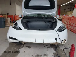 2023 Tesla Model Y Long Range with VIN 7SAYGDEE7PA100523, listed as a IAAI auction lot 40399455 with 18,885 mi miles and . Bid and sale history available at DreamBid. Image 12.