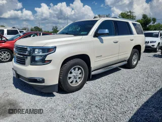 2015 Chevrolet Tahoe LTZ z VIN 1GNSKCKC1FR191256, wystawiony jako Copart lot #58760075 z przebiegiem 159 524 mil mil oraz Czysty tytuł • Clean title. Historia ofert i sprzedaży dostępna na DreamBid. Obrazek 1.