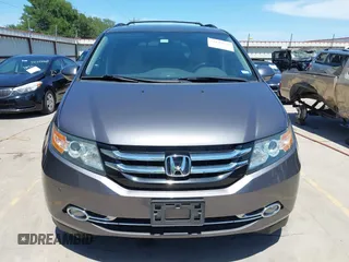 2015 Honda Odyssey Touring Elite z VIN 5FNRL5H99FB017517, wystawiony jako IAAI lot #42246066 z przebiegiem 104 878 mil mil oraz . Historia ofert i sprzedaży dostępna na DreamBid. Obrazek 12.