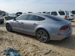 2016 Audi A7 Prestige with VIN WAU2GAFC9GN018146, listed as a Copart auction lot 60265005 with 115,330 mi miles and Salvage title. Bid and sale history available at DreamBid. Image 2.