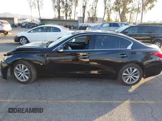 2015 Infiniti Q50 Premium z VIN JN1BV7AP5FM346323, wystawiony jako IAAI lot #41305093 z przebiegiem 112 556 mil mil oraz . Historia ofert i sprzedaży dostępna na DreamBid. Obrazek 14.