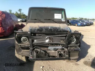 2005 Mercedes-Benz G-Class with VIN WDCYR49E25X156547, listed as a IAAI auction lot 38640157 with 241,209 mi miles. Bid and sale history available at carsss.com. Image 12.
