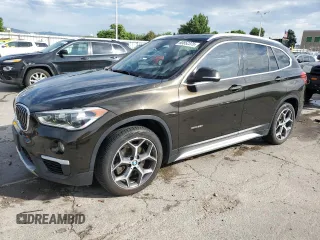 2017 BMW X1 xDrive28i with VIN WBXHT3C32H5F71690, listed as a Copart auction lot 60852375 with 67,475 mi miles and Salvage title. Bid and sale history available at DreamBid. Image 1.