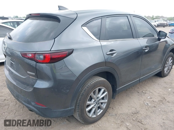 2023 Mazda CX-5 S Carbon Edition z VIN JM3KFBCM7P0226930, wystawiony jako IAAI lot #41939956 z przebiegiem 29 477 mil mil oraz . Historia ofert i sprzedaży dostępna na DreamBid. Obrazek 4.