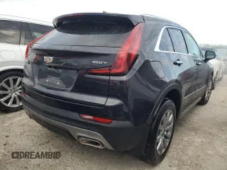 2022 Cadillac XT4 FWD Premium Luxury z VIN 1GYFZCR44NF166169, wystawiony jako Copart lot #77981414 z przebiegiem 9 734 mil mil oraz Nie do naprawy • Non repairable. Historia ofert i sprzedaży dostępna na DreamBid. Obrazek 3.