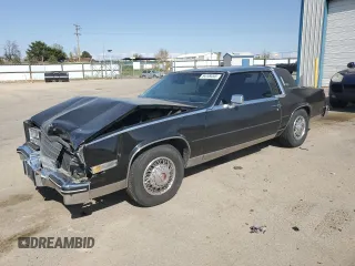 1985 Cadillac Eldorado z VIN 1G6EL5780FE622179, wystawiony jako Copart lot #54109205 z przebiegiem 73 403 mil mil oraz Szkoda całkowita • Salvage title. Historia ofert i sprzedaży dostępna na DreamBid. Obrazek 1.