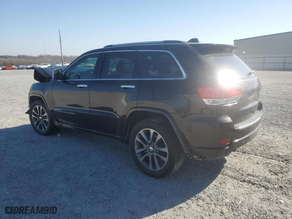 2017 Jeep Grand Cherokee Overland with VIN 1C4RJECG2HC712823, listed as a Copart auction lot 48063325 with 124,812 mi miles and Salvage Title. Bid and sale history available at carsss.com. Image 2.