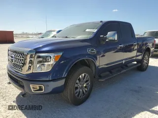 2017 Nissan Titan Platinum Reserve z VIN 1N6BA1F4XHN569794, wystawiony jako Copart lot #77390944 z przebiegiem Nie podano mil oraz Szkoda całkowita • Salvage title. Historia ofert i sprzedaży dostępna na DreamBid. Obrazek 1.