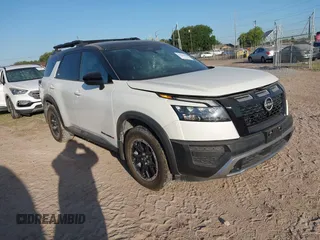 2023 Nissan Pathfinder Rock Creek with VIN 5N1DR3BD6PC254342, listed as a IAAI auction lot 41950069 with 26,144 mi miles and . Bid and sale history available at DreamBid. Image 1.