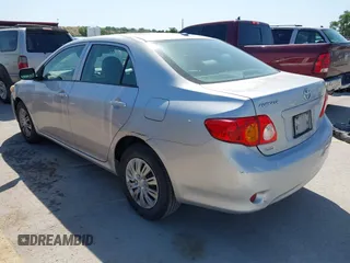 2009 Toyota Corolla with VIN 1NXBU40E79Z134599, listed as a IAAI auction lot 42035077 with 154,051 mi miles. Bid and sale history available at carsss.com. Image 3.